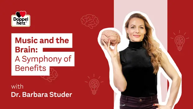 Imagen que presenta a la Dra. Barbara Studer, quien sostiene un modelo de cerebro. El texto destaca el tema "Música y el cerebro: una sinfonía de beneficios". Fondo rojo con elementos visuales relacionados con la neurociencia y la música.